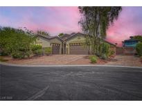 Charming home with a two-car garage, RV parking, and a well-manicured front yard at 8732 Kendall Brook Cir, Las Vegas, NV 89149