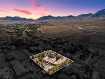 Gorgeous aerial view of estate home with mountains in the background during sunset at 912 Santa Ynez Ave, Henderson, NV 89002