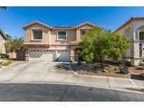 Charming two-story home features a three-car garage and well-maintained landscaping at 1048 Painted Daisy Ave, Henderson, NV 89074