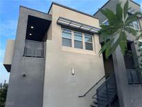 Contemporary home featuring multi-tone paint scheme and a private balcony for outdoor enjoyment at 11257 Rainbow Peak Ave # 201, Las Vegas, NV 89135