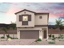 Charming two-story home with a two car garage, desert landscaping, and a tile roof at 246 Kobuk Ave, Henderson, NV 89011