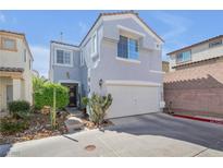 Charming two-story home featuring a two-car garage and low-maintenance landscaping at 2707 Commitment Ct, North Las Vegas, NV 89031
