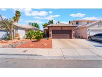 Charming single-story home with desert landscaping and a two-car garage at 5978 Autumn Harvest Ave, Las Vegas, NV 89142