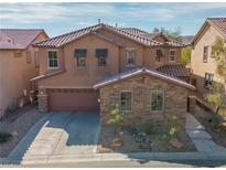 Charming two-story home featuring desert landscaping, a brick facade and a two-car garage at 7125 Mountain Den Ave, Las Vegas, NV 89179