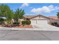 Charming single-story home with a well-maintained lawn and a two-car garage, located in a quiet neighborhood at 8114 Lapis Harbor Ave, Las Vegas, NV 89117