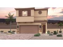 Two-story tan home featuring stone accents, a two-car garage, and desert landscaping at 888 Arbor Spring St, Henderson, NV 89011