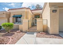 Charming single-story home featuring a well-maintained landscape with a quaint gated entrance at 8929 Marble Dr, Las Vegas, NV 89134