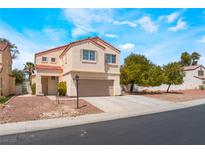 Charming two-story home with red tile roof and neutral stucco exterior, showcasing a well-maintained front yard at 6715 Maple Mesa St, North Las Vegas, NV 89084