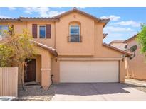 Charming two-story home with a two car garage and a well-maintained front yard at 1041 Grand Cerritos Ave, Las Vegas, NV 89183