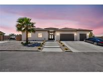 Charming single-story home featuring a tile roof, desert landscaping, and a spacious driveway at 12720 Davis Wright Ct, Henderson, NV 89044