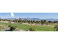 Scenic golf course view with lush green fairway and mountain backdrop at 2024 Bay Tree Dr, Las Vegas, NV 89134