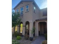 Charming two-story home featuring an arched porch entry and well-maintained landscaping at 2862 Starling Summit St, Henderson, NV 89044