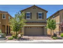Charming two-story home with desert landscaping and a brick-paved driveway leading to a spacious two car garage at 2936 Aragon Terrace Way, Henderson, NV 89044
