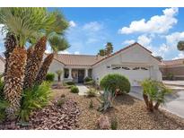 Charming single-story home with mature landscaping, rock garden, and a two-car garage at 3024 Lotus Hill Dr, Las Vegas, NV 89134