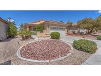 Charming single-story home featuring a low-maintenance rock garden and well-manicured landscaping at 3056 Monroe Park Rd, Henderson, NV 89052