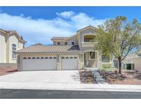 Charming two-story home features a three-car garage and drought resistant landscaping at 3079 Evening Mist Ave, Henderson, NV 89052