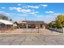 Charming single-story home with a fenced yard, solar panels, and a private driveway at 3112 Twining Ave, North Las Vegas, NV 89030