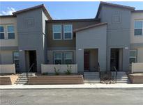 Stylish townhome featuring a neutral color scheme, modern architectural details, and an inviting entrance at 3762 Sonrisa Vista Ave, Henderson, NV 89044