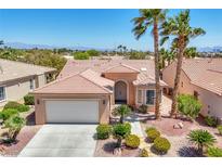 Charming single-story home features desert landscaping, an attached two-car garage, and a tiled roof at 5078 Rivedro St, Las Vegas, NV 89135