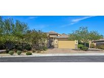 Charming single-story home features a two-car garage, beautiful desert landscaping, and gated entry at 6975 Hopi Summit Ct, Las Vegas, NV 89149