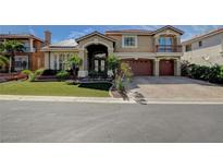 Charming two-story home featuring a red tile roof, desert landscaping, and a three-car garage at 7619 Belgian Lion St, Las Vegas, NV 89139