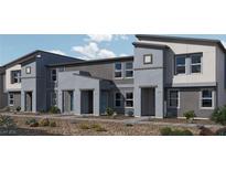 Modern townhome exterior featuring desert landscaping, unique architecture, and private entrances at 9326 Soothing Sea St # Lot 93, Las Vegas, NV 89178