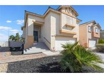 Attractive two-story home featuring a well-manicured front yard and an attached two-car garage at 1808 Quartz Landing Ave, Las Vegas, NV 89183