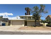 Inviting two-story home featuring a spacious two-car garage and charming second-story balcony at 2724 Natalie Ave, Las Vegas, NV 89121