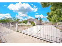 Charming single-story home featuring a secure fenced yard and well-lit driveway at 45 Prince Ln, Las Vegas, NV 89110