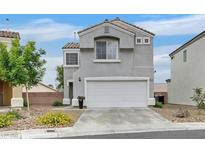 Inviting two-story home featuring a neutral color palette, two-car garage and low maintenance landscaping at 4820 Integrity St, North Las Vegas, NV 89031