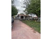 Charming single-story home featuring a spacious front yard and inviting curb appeal at 4834 E Van Buren Ave, Las Vegas, NV 89110