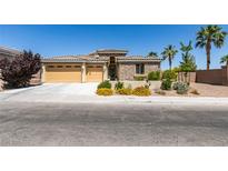 Charming single-story home featuring a well-manicured lawn and a three-car garage at 768 Flowing Meadow Dr, Henderson, NV 89014