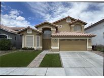 Charming two-story home with a well-manicured lawn and a two-car garage, perfect for a Gathering at , Las Vegas, NV 89129