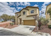 Charming two-story home featuring neutral stucco, a two-car garage, and a well-kept, low maintenance desert landscape at 10513 Bandera Mountain Ln, Las Vegas, NV 89166
