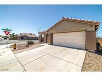 Charming single-story home featuring a two-car garage and desert landscaping at 1301 Nugget Creek Dr, Las Vegas, NV 89108