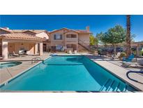 Inviting community pool with sun loungers and seating areas at this complex, perfect for relaxation and socializing at 350 S Durango Dr # 220, Las Vegas, NV 89145