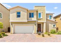 Charming two-story home with a well-maintained front yard and attached garage at 7189 Ashcroft St, North Las Vegas, NV 89084
