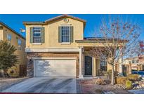 Charming two-story home with a well-maintained lawn, a two-car garage, and a welcoming front porch at 7337 Savannah Falls St, Las Vegas, NV 89131