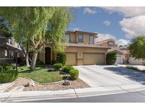 Charming two-story home with landscaped yard, mature tree and a spacious two-car garage and large driveway at 7736 Villa Andrade Ave, Las Vegas, NV 89131