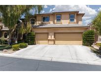 Two-story home featuring a three-car garage and well-maintained landscaping at 7736 Villa Andrade Ave, Las Vegas, NV 89131