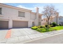 Charming two-story home with well-manicured lawn and mature landscaping at 502 Cosmic Star Pl, Henderson, NV 89052