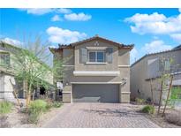 Charming two-story home with a two-car garage and a well-maintained paver driveway at 5252 Sunstone Mesa Dr, Las Vegas, NV 89166