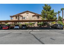 Charming condo building with covered parking and well maintained landscaping at 5751 E Hacienda Ave # 105, Las Vegas, NV 89122