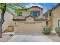 Charming two-story home featuring a two-car garage and a well-maintained front yard at 6549 Butterfly Sky St, North Las Vegas, NV 89084