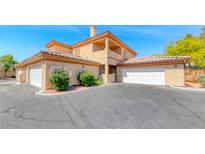 Beautiful two-story home featuring a tile roof, multiple garages, and manicured landscaping at 6916 Dorita Ave # 102, Las Vegas, NV 89108