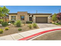 Charming single-story home featuring a stone facade and a two-car garage at 7473 Deschutes Cir, Las Vegas, NV 89129