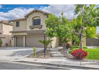 Charming two-story home features a well-maintained lawn and attached two car garage at 8217 Fritzen Ave, Las Vegas, NV 89131