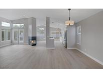 Spacious living room featuring a fireplace and plenty of natural light at 8228 Lauderdale Ct, Las Vegas, NV 89128