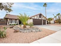 Charming single-story home featuring a well-manicured yard and two-car garage at 1528 Tonada Way, Las Vegas, NV 89117
