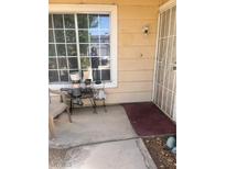 Inviting front porch with seating, a security door, and a large window, creating a warm welcome to the home at 1676 Divinity St, Las Vegas, NV 89142